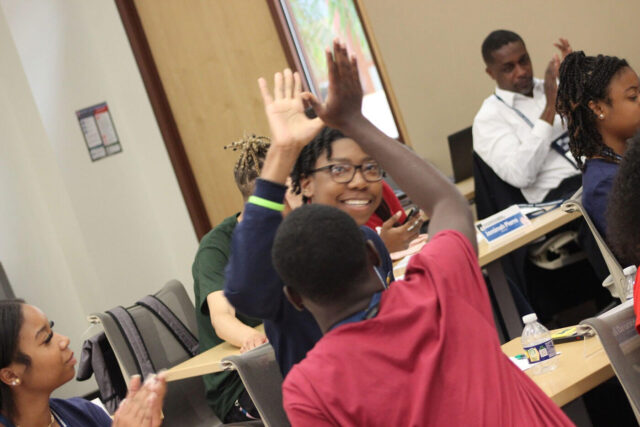 jrf scholars high fiving in session