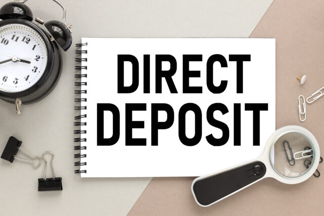 direct,deposit.,notepad,on,a,background,of,different,colors.,brown,