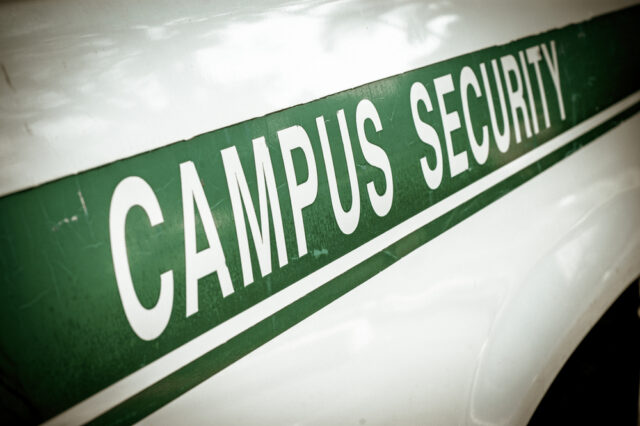 retro,filtered,campus,security,sign,on,the,side,of,a